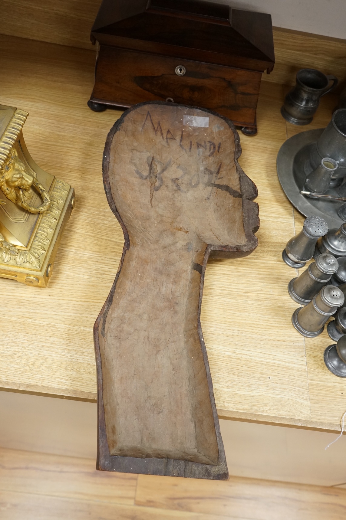 A carved African tribal hardwood wall plaque, 64cm high